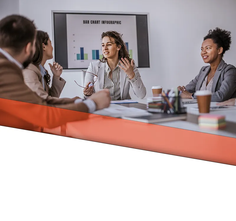 loutel llc investigations banner mobile A team discussing and strategizing business ideas and ideas in a conference room.