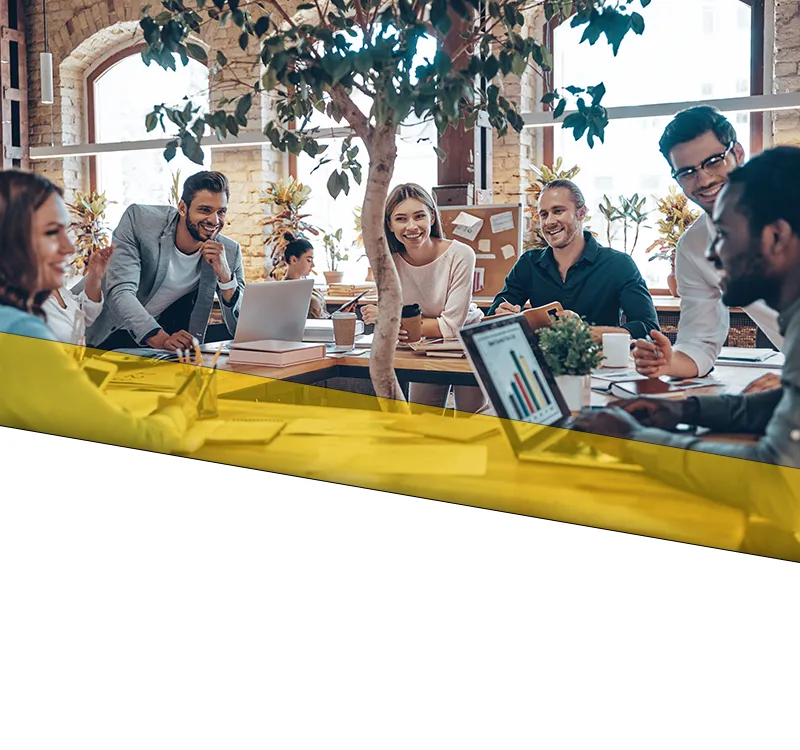 loutel llc welcome banner mobile A team going through business plans and ideas in a conference room.