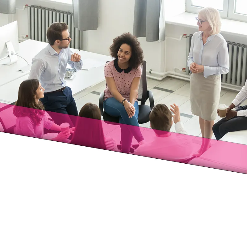 placeholder 4 A team going through business plans and ideas in a conference room.